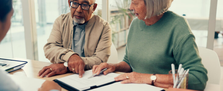 married elderly clients signing paperwork for trusts